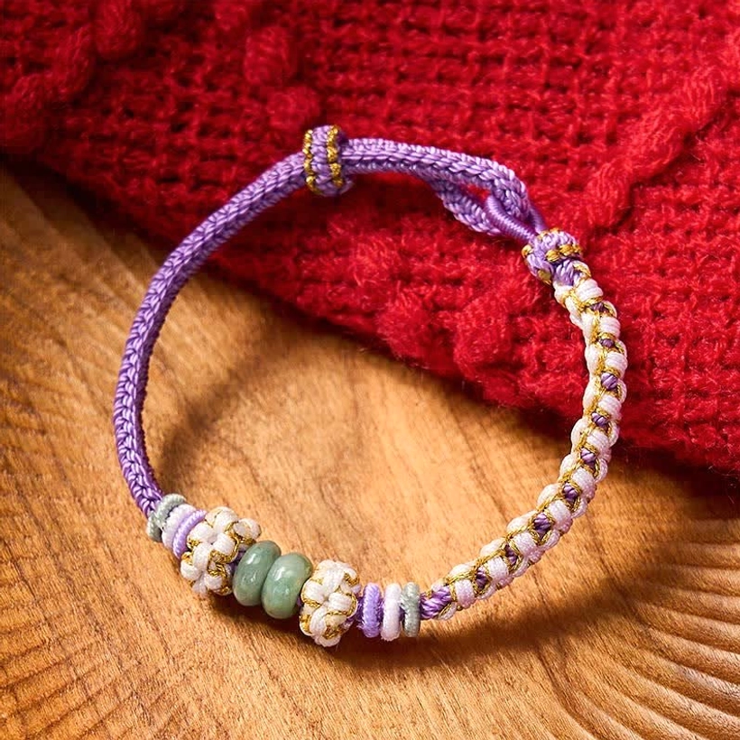 Jade stone bracelet red cord woven knot artistic presentation