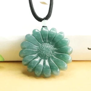 Hand-carved deep green jade sunflower pendant necklace on black cord, front flat view with white spacer bead