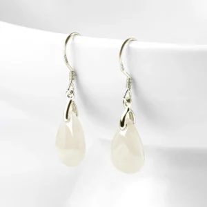 Jade teardrop dangle earrings with 925 sterling silver fishhook earwires on white ceramic background, front view showing milky white and silvery tones