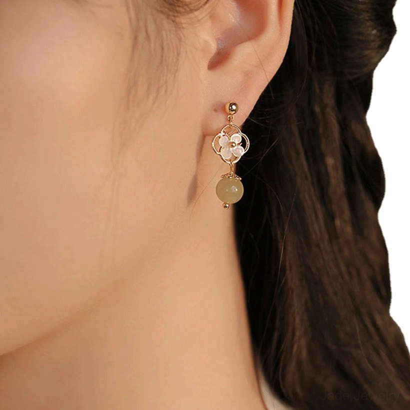 Jade tridacna flower drop earrings lifestyle image, showing the earrings worn with elegant styling and sophisticated look
