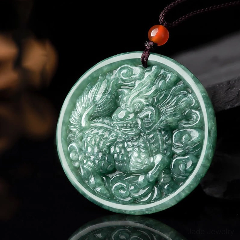 Exquisite kirin and cloud carving detail on jade pendant necklace, macro close-up