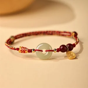 Handmade koi fish lucky bracelet featuring enamel koi bead, cinnabar beads, engraved sterling silver tag, and authentic Hetian jade peace buckle