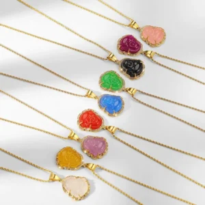 Multi-color Laughing Buddha jade necklaces with 18K gold filled chains displayed in flat lay overhead view, showing various jade color options including green, white, pink, red, and blue with rhinestone accents