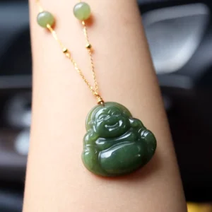 Laughing Buddha Hetian jade pendant necklace worn on wrist with gold chain and jade beads close-up