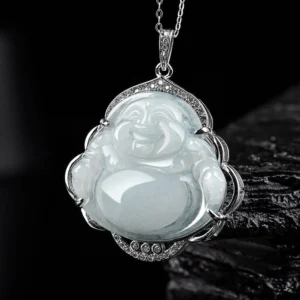 Laughing Buddha jade pendant necklace close-up showing carved smiling face with crystal-studded titanium steel frame