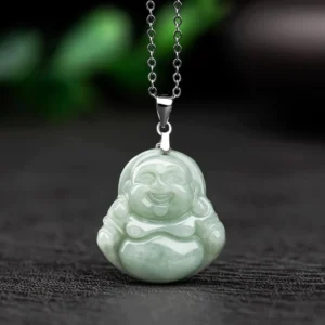 Laughing Buddha jade pendant necklace front view with light green natural jade Maitreya Buddha carving and silver titanium steel curb chain on dark wood background