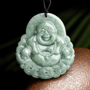 Laughing Buddha natural jade pendant with copper coin carving, celadon green stone, front view with black cord on dark background