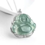 Laughing Buddha green jade pendant necklace with titanium steel setting and decorative accents, front three-quarter studio view on white background