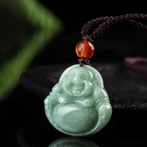 Laughing Buddha jade necklace three-quarter side view showing carved Buddha face and amber bead accent on brown cord