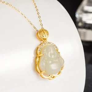 Side profile of Laughing Buddha white jade pendant showing detailed carving and polished silver bezel setting