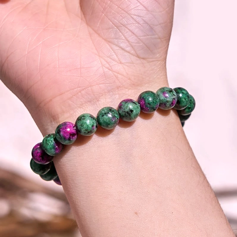 Lazurite jade balance bracelet, overhead display showing serene blue-purple polished round beads on elastic string