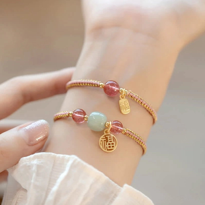 Lotus flower charm detail on red agate confidence and prosperity stone bracelet