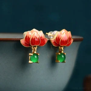 Lotus jade earrings pearl ear posts detail, fine gold-tone claw setting holding green jade drop, hand-painted red cloisonné lotus