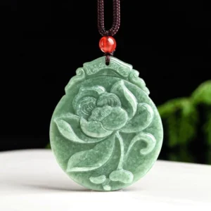 Hand-carved lotus jade pendant necklace in front view, displaying detailed floral engraving on dark green natural jade with brown hemp cord and red accent bead - prosperity and spiritual growth symbol
