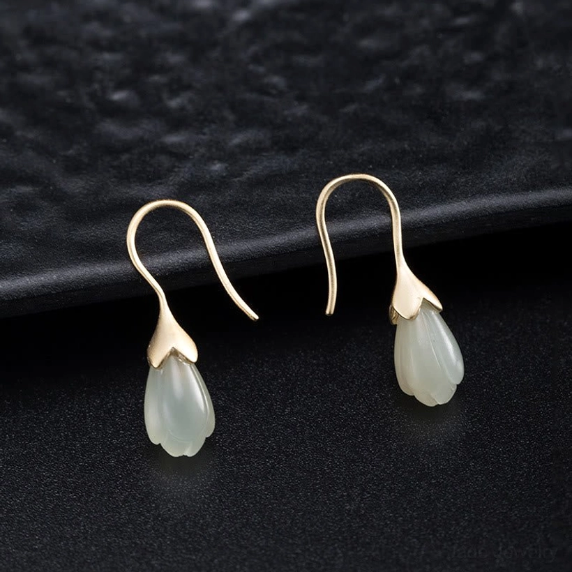 hetian jade magnolia drop earrings flat lay front view polished silver nephrite