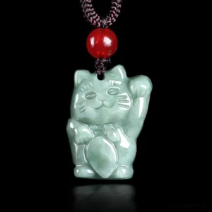 Maneki Neko jade lucky cat pendant front view, light green polished jade with raised left paw, red bead and black cord necklace