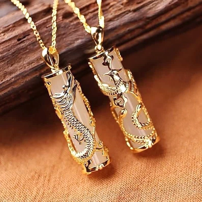 Matching pair of white jade dragon pendants with identical hand-carved designs and polished gold-plated copper chains