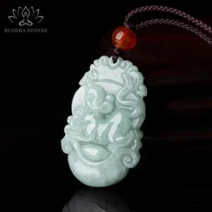 Monkey Chinese zodiac jade pendant necklace with red agate bead and brown cord on dark background