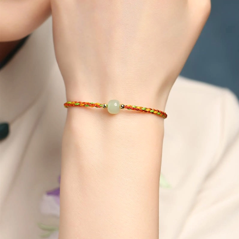Rainbow multicolor jade bead bracelet on hand showing comfortable fit and vibrant colors