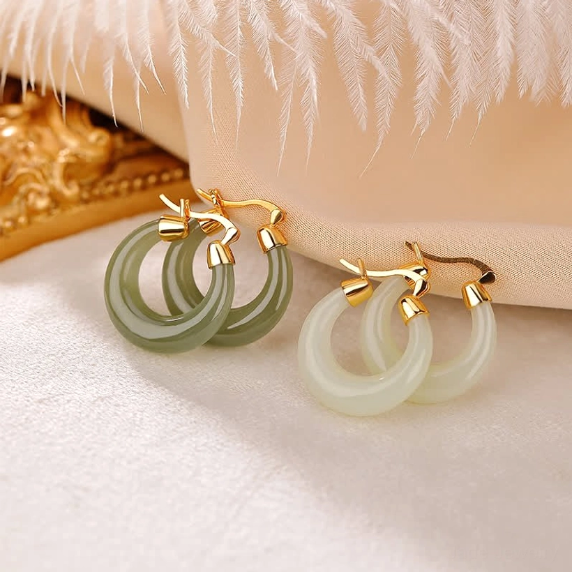 Two pairs of natural jade and cyan jade drop earrings with gold plating on satin fabric background, featuring vintage golden decor, showcasing both jade color options