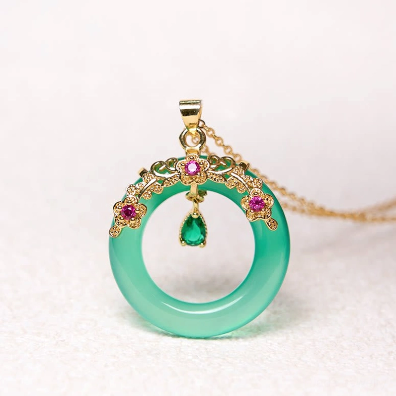 Green chalcedony peace buckle pendant with pink center gemstone and polished jade ring