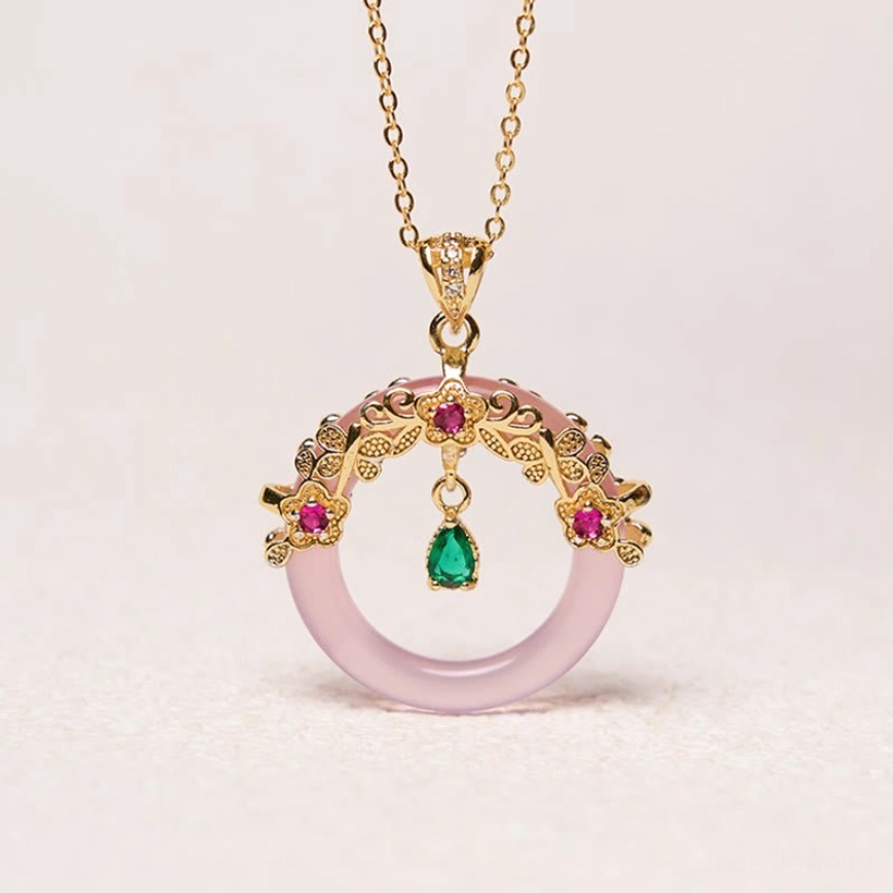 Peace buckle pendant necklace with pink gemstone accent