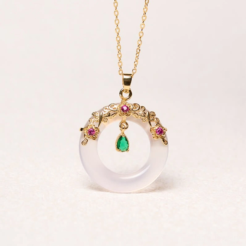 Peace buckle pendant showing smooth gemstone surface and coin design