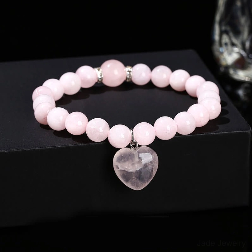 Pink rose quartz heart charm bracelet with metal spacer beads and elastic cord