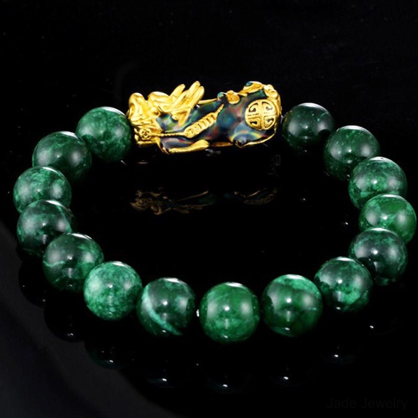 Green jade Pixiu bracelet overhead side view showing intricate gold enamel fortune beast charm