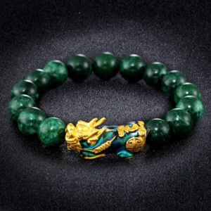 Pixiu jade bracelet with variegated deep green beads and ornate enamel Pixiu charm on black background