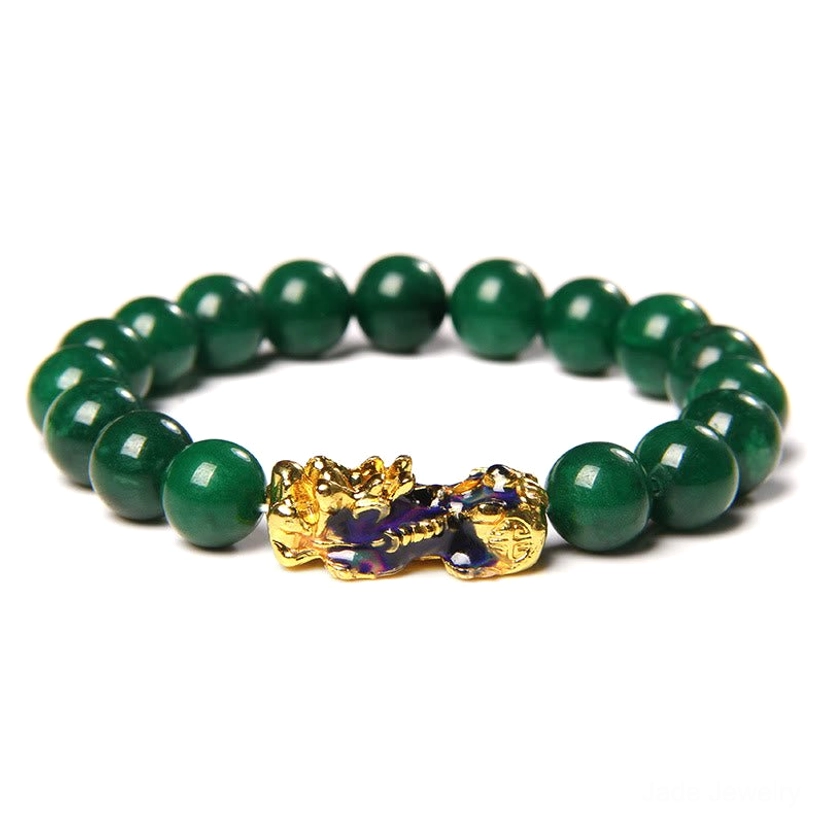 Front flat lay view of Pixiu jade abundance bracelet with dark green round jade beads and enamel gold Pixiu charm on white background