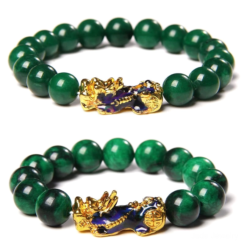 Two matching Pixiu jade bracelets with identical dark green jade beads and gold enamel Pixiu charms, overhead view on white background
