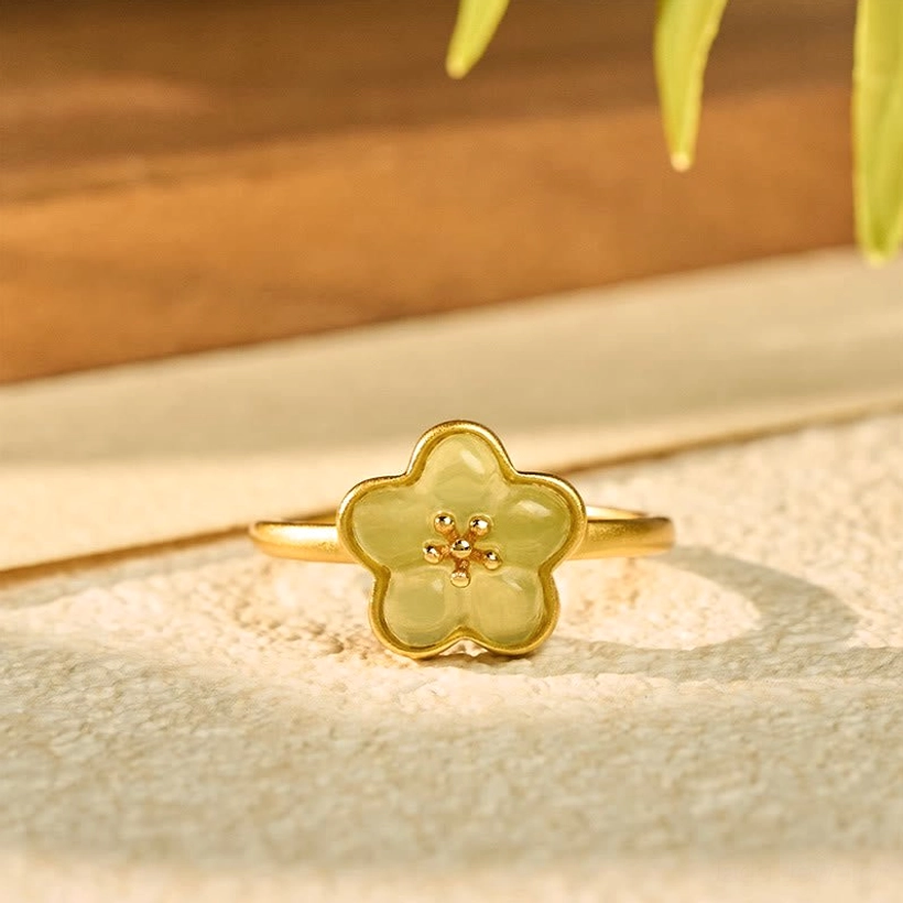 Plum Blossom Jade Copper Ring - Flat overhead view showing complete flower-shaped charm with matte gold finish