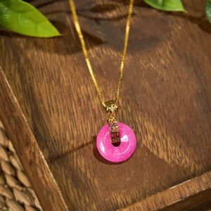 Purple jade peace buckle pendant close-up side angle, showing smooth polished jade stone and delicate chain