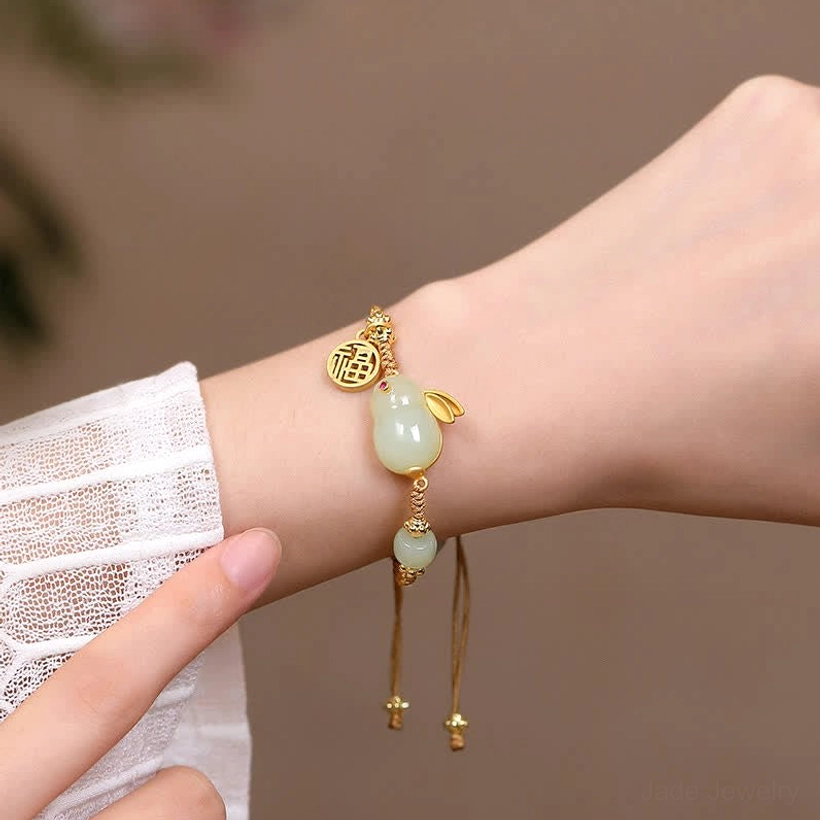 Adjustable braided Hetian jade Rabbit bracelet with tassel closure on wrist