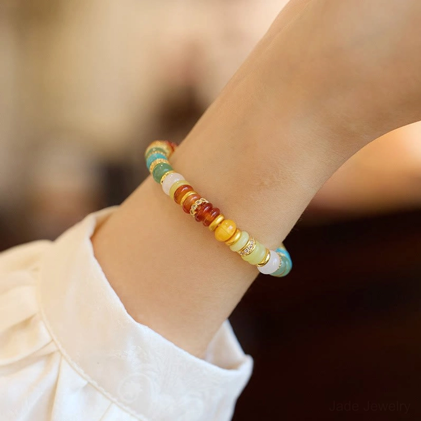 Rainbow jade confidence bracelet worn on woman's wrist showing fit and comfort with natural gemstones