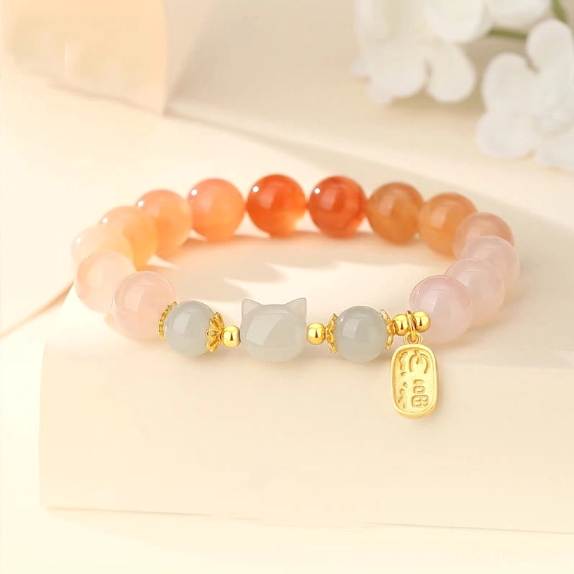 Red agate Hetian jade cat Fu character sterling silver bracelet flat lay with floral decoration