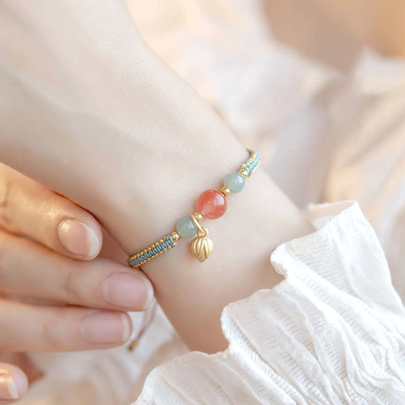 Red agate lotus confidence bracelet styled on wrist during daily wear