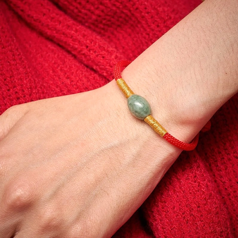 Red jade protection bracelet worn on wrist showing real wearing effect and sizing on human arm