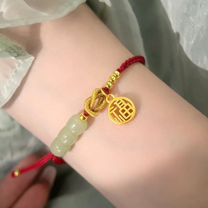 Red string jade Fu bracelet with adjustable braided cord - showing protective red rope symbolism and natural jade stone quality