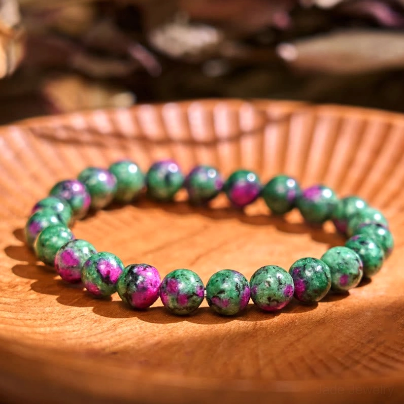 Ruby zoisite anyolite jade balance bracelet, flat lay display showing deep red-purple and green mixed gemstone beads
