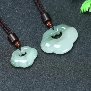 Two sizes of ruyi jade lock charm pendants comparison, small and large Tianshan jade stones with brown cords