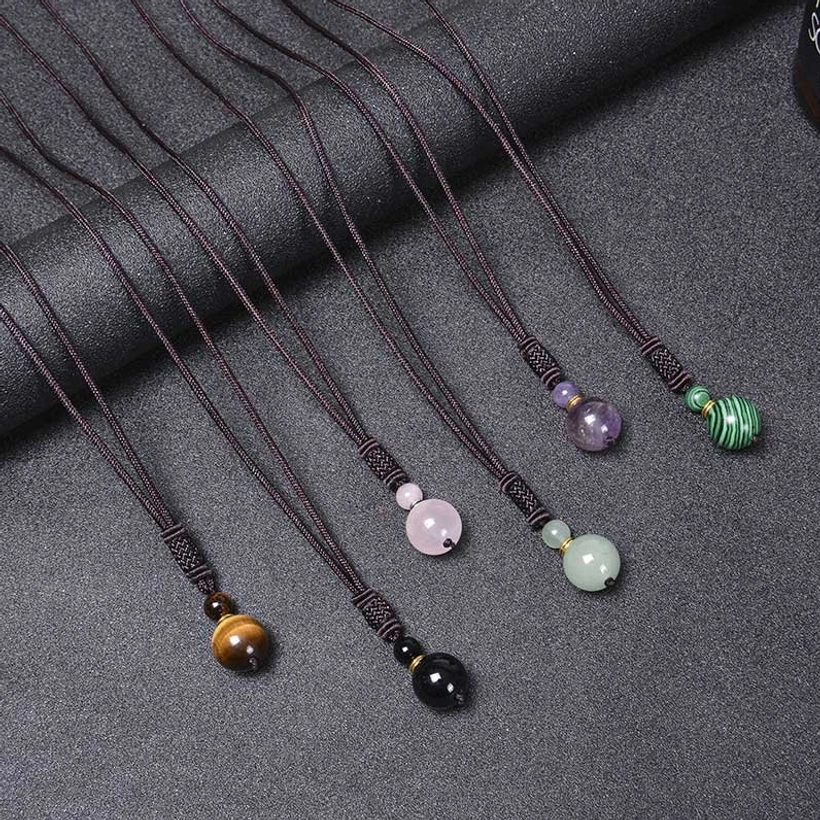 Complete seven-stone harmony necklace showing all six gemstone varieties laid out