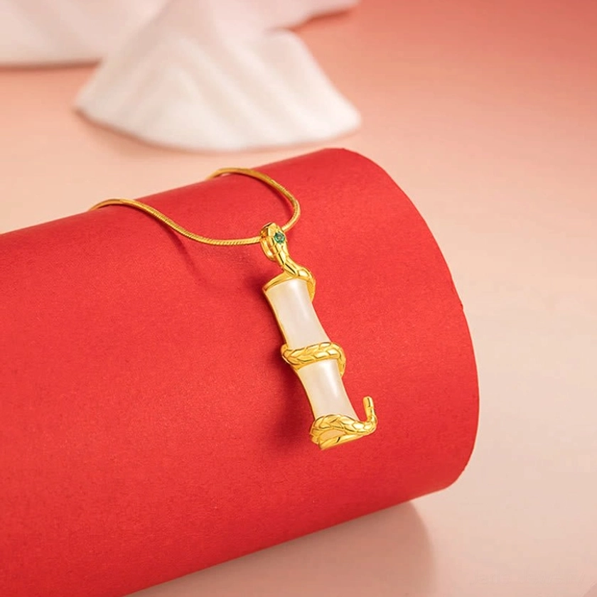 Snake zodiac jade pendant side angle - gold sterling silver wrapped around white bamboo jade with natural stone texture