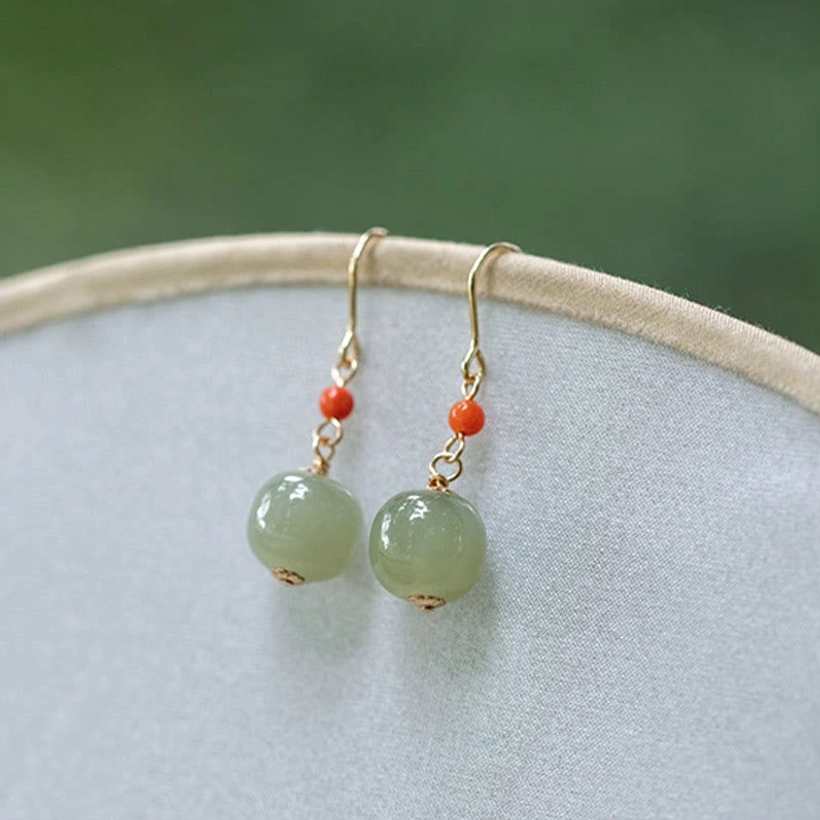 925 sterling silver plated 14K gold hetian jade drop earrings with red agate detailed product photography
