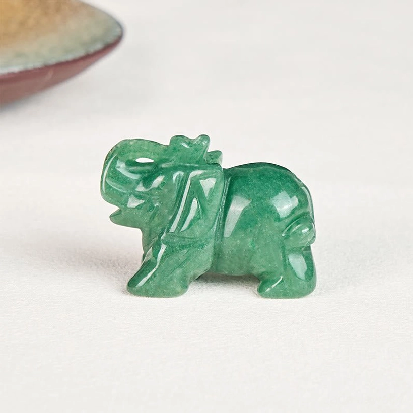 Stone elephant figurine with authentic healing crystal properties and symbolism