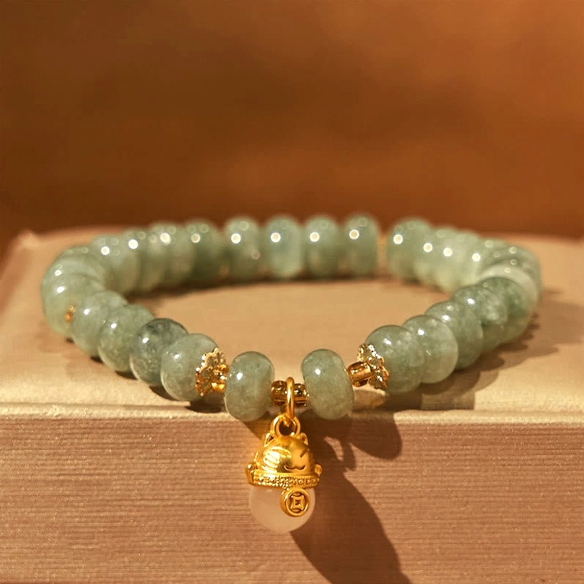 Pink Strawberry Quartz Bracelet with Gold Lucky Cat - Flat Lay Lifestyle Display