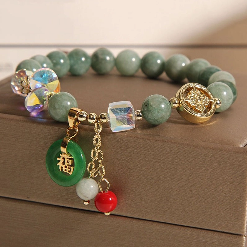 Strawberry quartz Fu character bracelet side angle showing elastic string construction and bead arrangement
