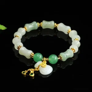 Tianshan jade Fu character prosperity bracelet with white jade beads, green aventurine accents, and gold copper spacers - angled display