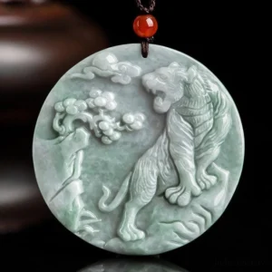 Hand-carved tiger jade protection necklace pendant, 52mm round light green jade with intricate carving details, displayed on dark background